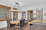 This stunning dining area boasts a blend of rustic charm and modern elegance.