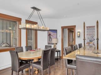 This stunning dining area boasts a blend of rustic charm and modern elegance.