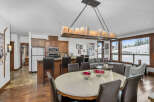Experience luxury living in this stunning property, featuring a spacious dining area perfect for entertaining.