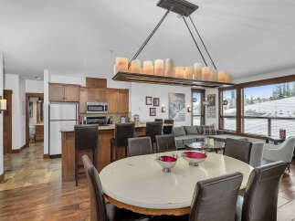 Experience luxury living in this stunning property, featuring a spacious dining area perfect for entertaining.