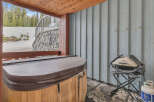Relax and unwind in this luxurious outdoor space, complete with a hot tub and a grill.