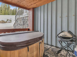 Relax and unwind in this luxurious outdoor space, complete with a hot tub and a grill.