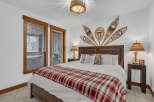 This cozy bedroom features a rustic cabin aesthetic, perfect for a relaxing retreat.