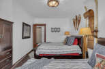 This cozy bedroom features a rustic ski lodge theme, perfect for a mountain getaway.