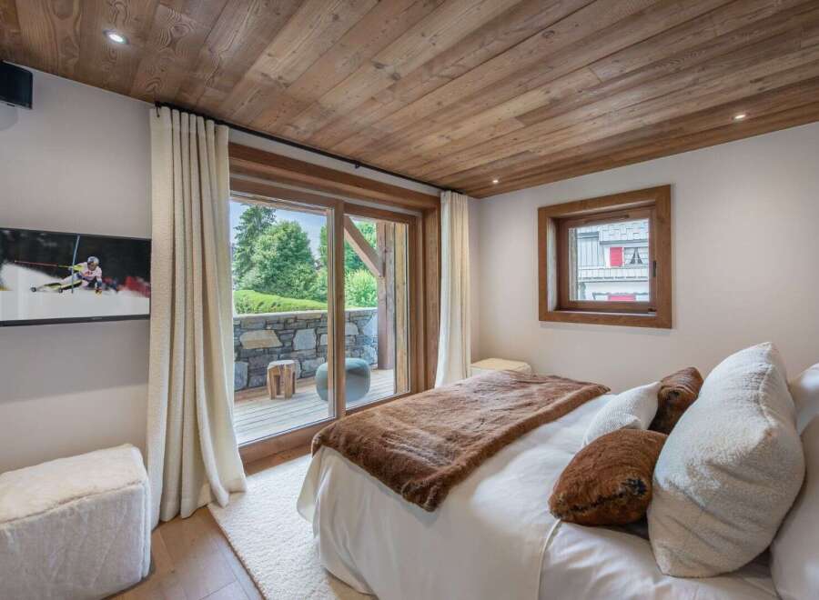Experience luxury in this stunning bedroom featuring a cozy ambiance and elegant design.