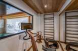 This luxurious home gym offers a serene workout experience with stunning views.