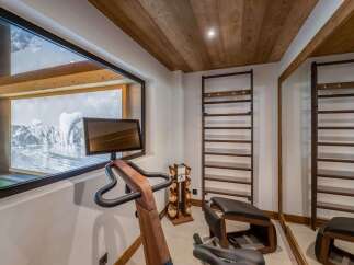 This luxurious home gym offers a serene workout experience with stunning views.