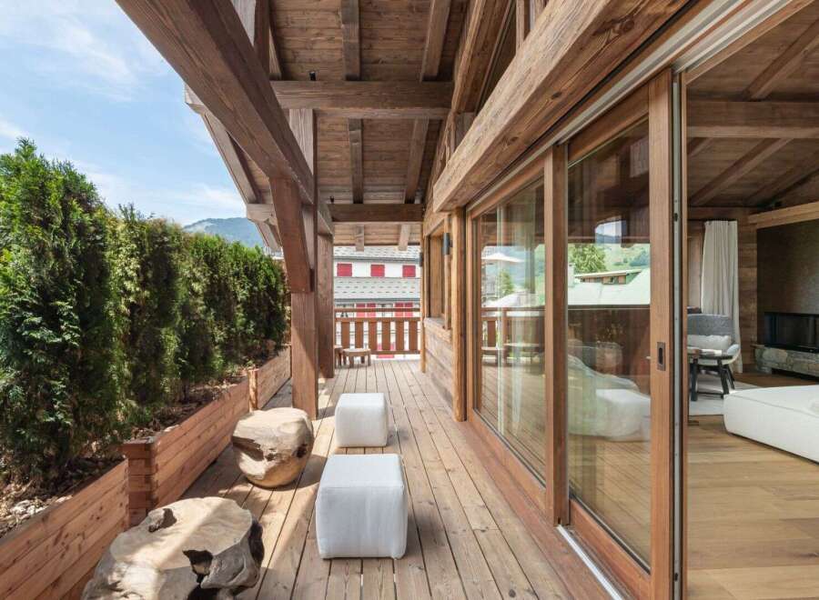 Experience luxury living with this stunning property featuring a spacious wooden deck and breathtaking views.