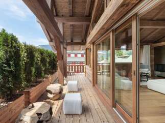 Experience luxury living with this stunning property featuring a spacious wooden deck and breathtaking views.