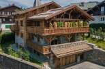 This stunning chalet-style home showcases exquisite craftsmanship and design.