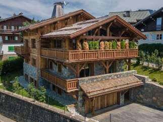 This stunning chalet-style home showcases exquisite craftsmanship and design.
