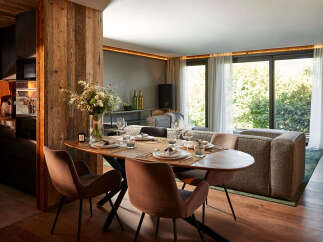 Experience luxury living in this stunning property, featuring a beautifully designed dining area perfect for entertaining.