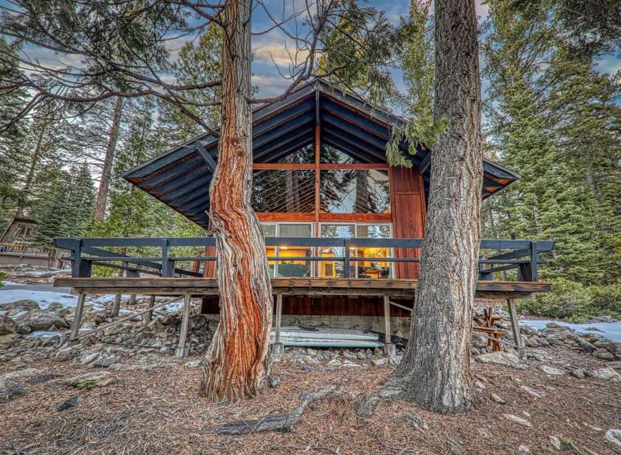 Nestled in a serene forest setting, this charming cabin offers a perfect blend of rustic charm and modern comfort.