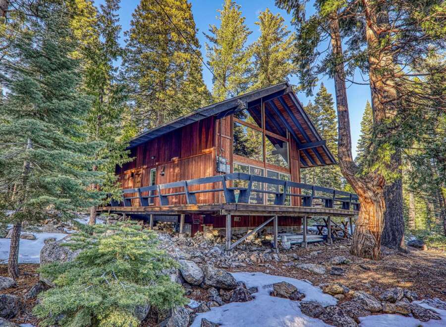 Nestled in a serene forest setting, this charming cabin offers a perfect blend of rustic charm and modern comfort.
