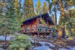 Nestled in a serene forest setting, this charming cabin offers a perfect blend of rustic charm and modern comfort.