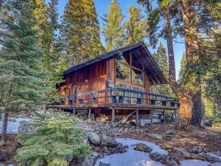 Nestled in a serene forest setting, this charming cabin offers a perfect blend of rustic charm and modern comfort.