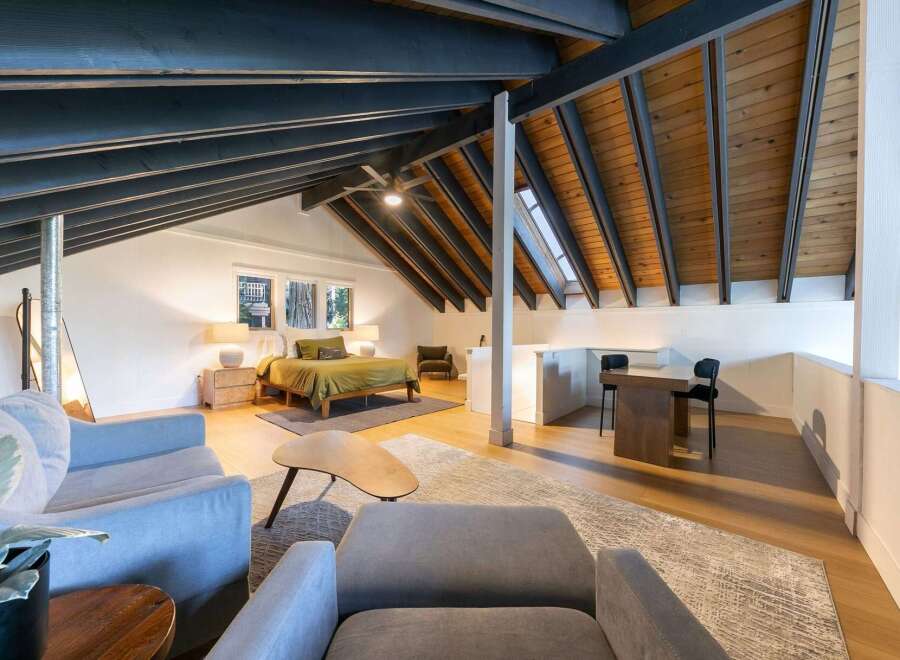 This stunning property boasts a unique architectural design with exposed beams and a loft-style layout.
