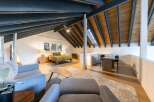 This stunning property boasts a unique architectural design with exposed beams and a loft-style layout.