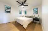 This cozy bedroom features a comfortable bed, perfect for a relaxing retreat.