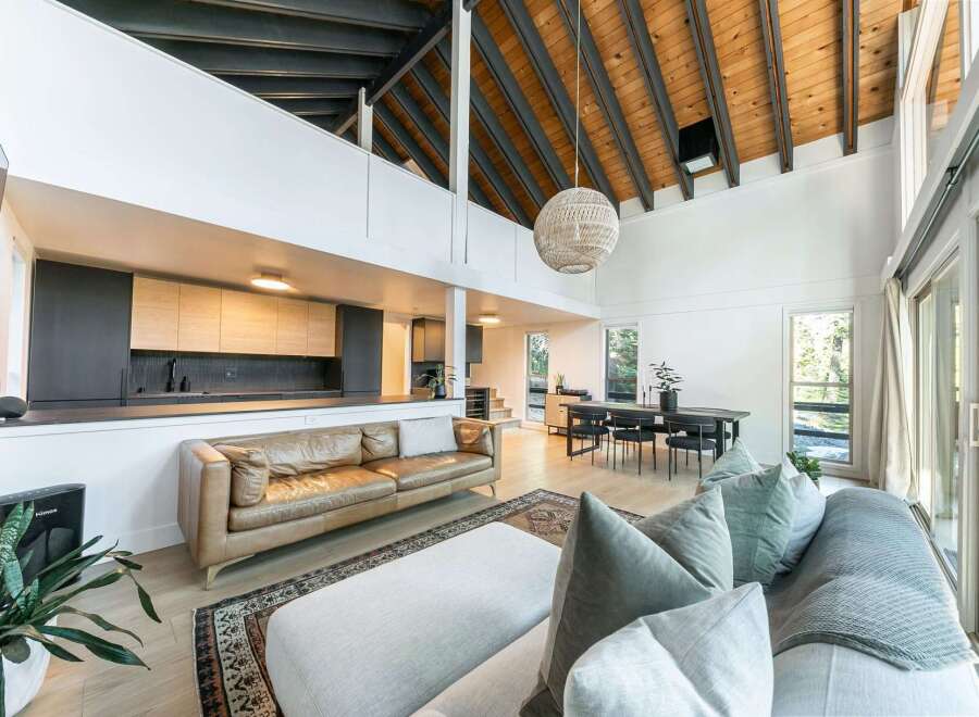 Experience modern living in this stunning home featuring a spacious open floor plan and high ceilings.