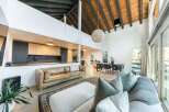 Experience modern living in this stunning home featuring a spacious open floor plan and high ceilings.