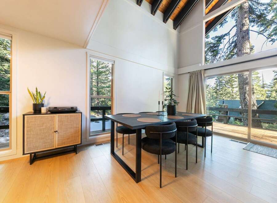 This stunning dining area boasts a modern aesthetic with a touch of nature.