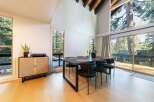 This stunning dining area boasts a modern aesthetic with a touch of nature.