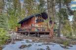 Nestled in a serene forest setting, this stunning cabin offers a perfect blend of rustic charm and modern comfort.