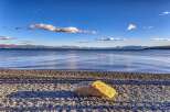 Enjoy breathtaking views of the lake and mountains from this stunning property.