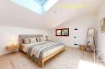This stunning bedroom boasts a modern design with a touch of elegance.