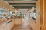 This stunning kitchen boasts a bright and airy design, perfect for culinary enthusiasts.