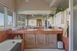 This spacious bathroom features a double vanity with ample counter space, perfect for getting ready in the morning.