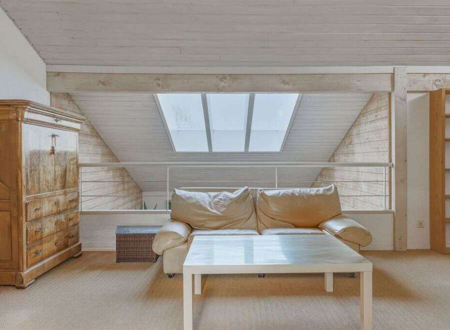This stunning property boasts a unique architectural design with a bright and airy living space.
