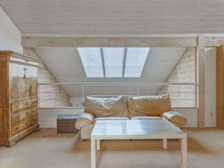 This stunning property boasts a unique architectural design with a bright and airy living space.