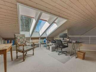 Discover a unique workspace in this charming attic room.