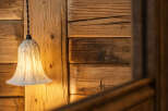 This stunning property features a rustic wooden wall, creating a warm and inviting atmosphere.