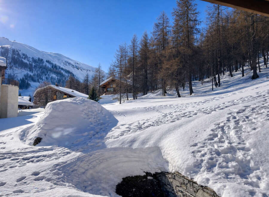 Discover the charm of this stunning mountain chalet nestled in a winter wonderland.