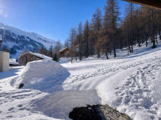 Discover the charm of this stunning mountain chalet nestled in a winter wonderland.