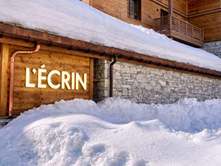 Discover the charm of this stunning property, nestled in a snowy landscape.