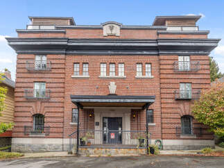 This stunning brick building offers a unique blend of classic architecture and modern living.