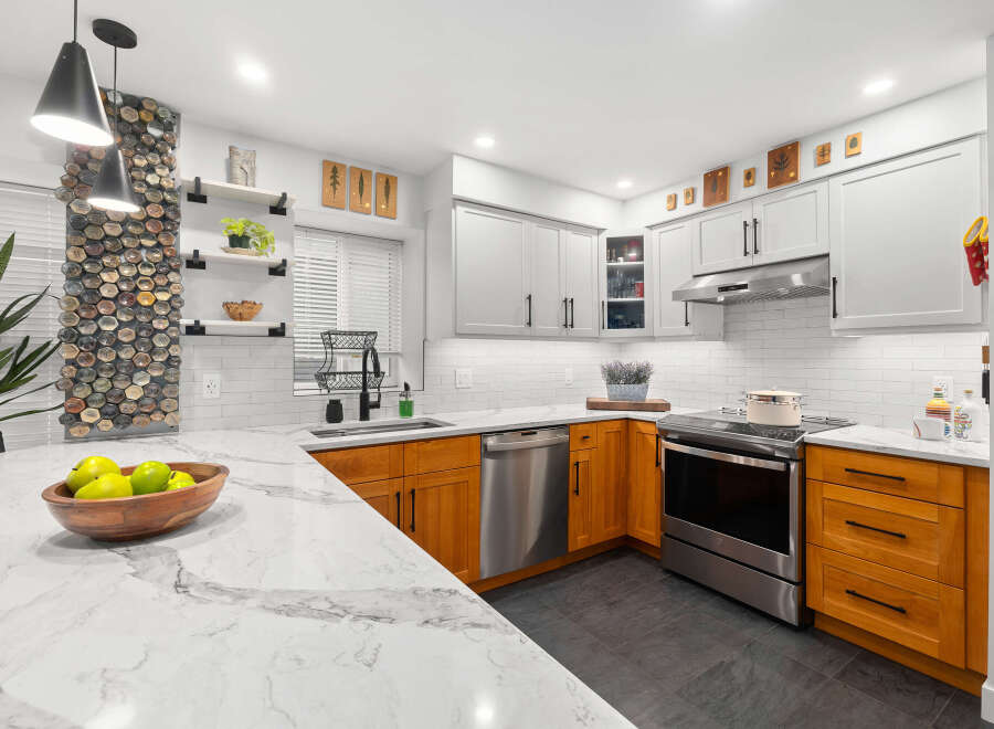 This stunning kitchen boasts a modern design with a touch of warmth.