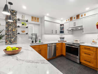 This stunning kitchen boasts a modern design with a touch of warmth.