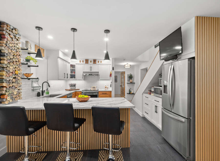 This stunning kitchen boasts modern design elements and high-end finishes.