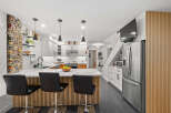 This stunning kitchen boasts modern design elements and high-end finishes.
