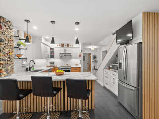 This stunning kitchen boasts modern design elements and high-end finishes.