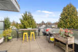 Enjoy outdoor living at its finest on this stunning balcony! This space features a stylish table and chairs, perfect for dining or relaxing.