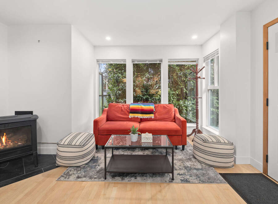 This inviting living space features a cozy fireplace, perfect for chilly evenings.