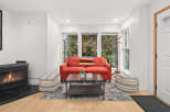 This inviting living space features a cozy fireplace, perfect for chilly evenings.