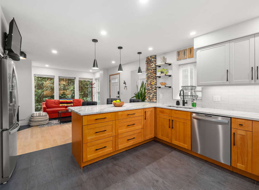 This stunning kitchen boasts a modern design with sleek stainless steel appliances and custom cabinetry.