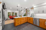 This stunning kitchen boasts a modern design with sleek stainless steel appliances and custom cabinetry.